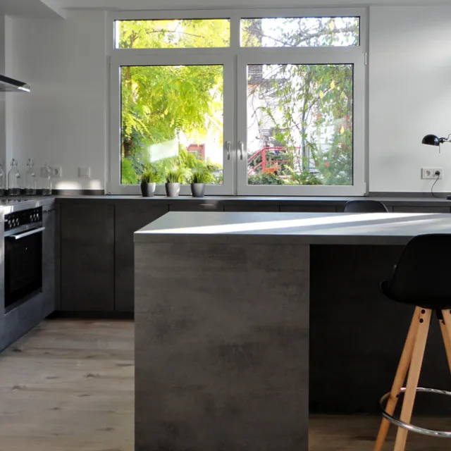 GRIMM Küchen - Moderne Referenzküche in Beton-Look